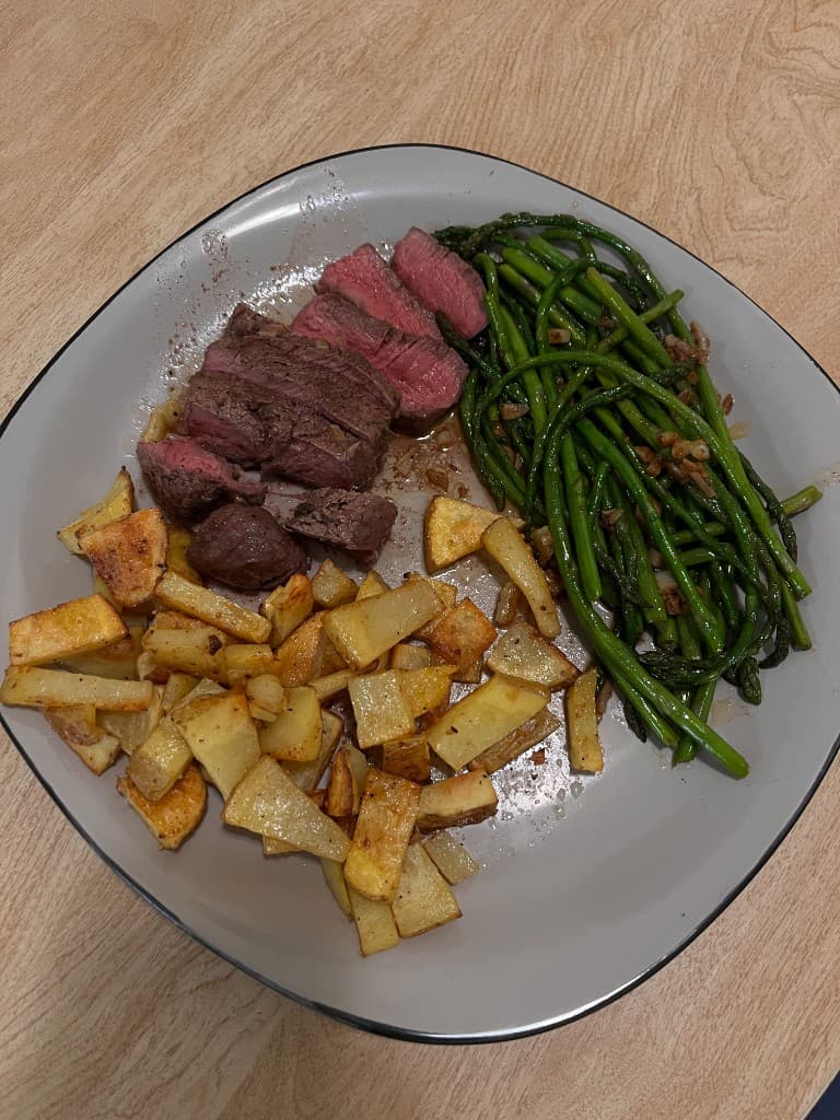 Steak dinner with asparagus and roasted potatoes