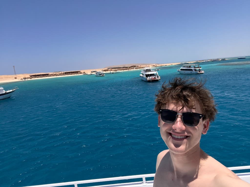 On a boat with turquoise ocean water